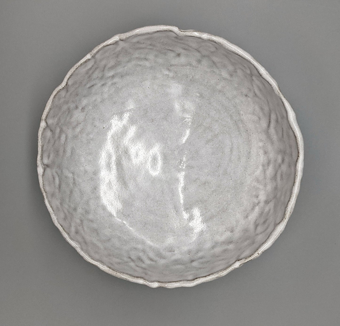 White glaze over concrete clay bowl