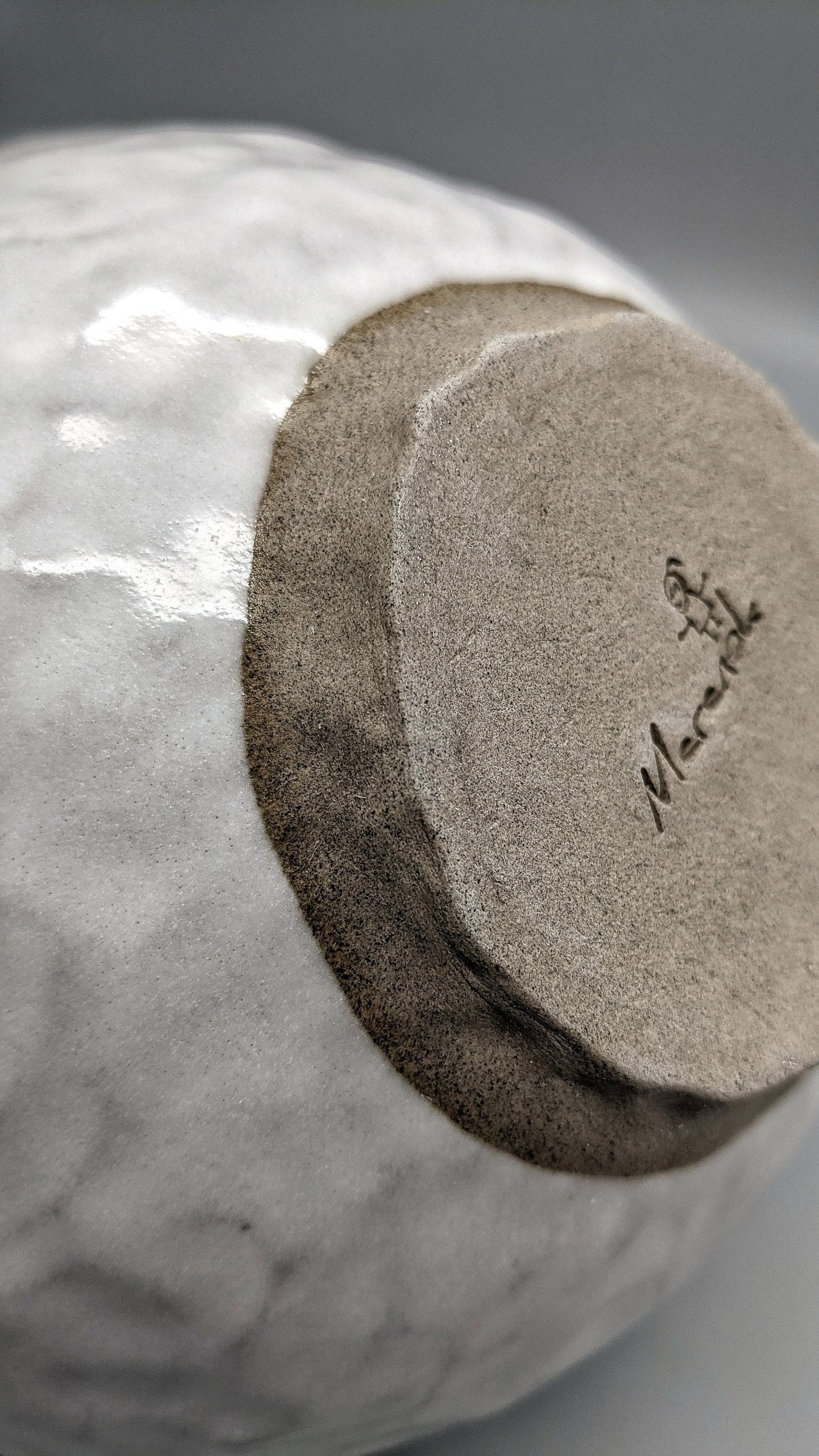 White glaze over concrete clay bowl